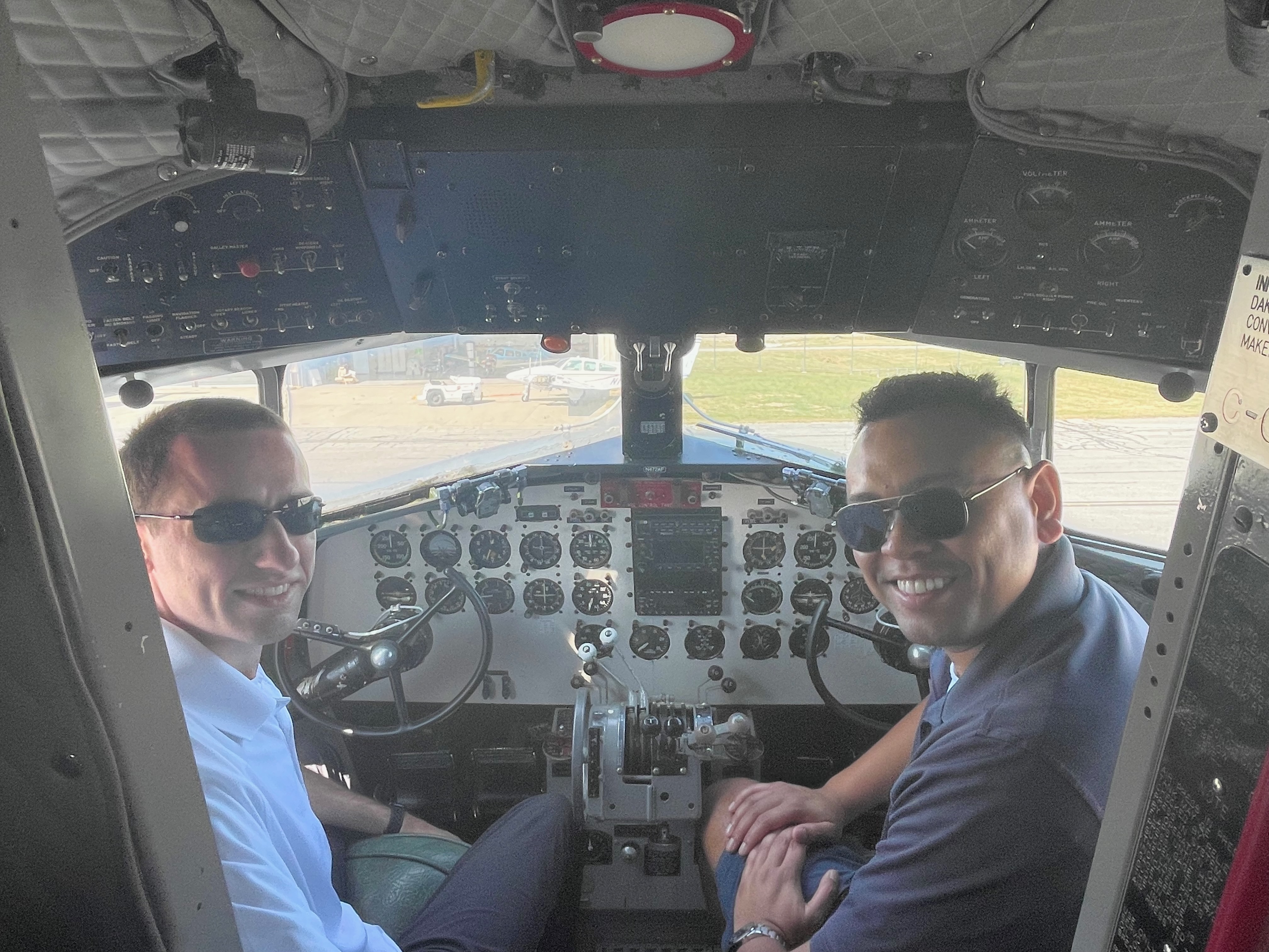 Me with one of my team members inside the cockpit of a C-47 Douglas Skytrain