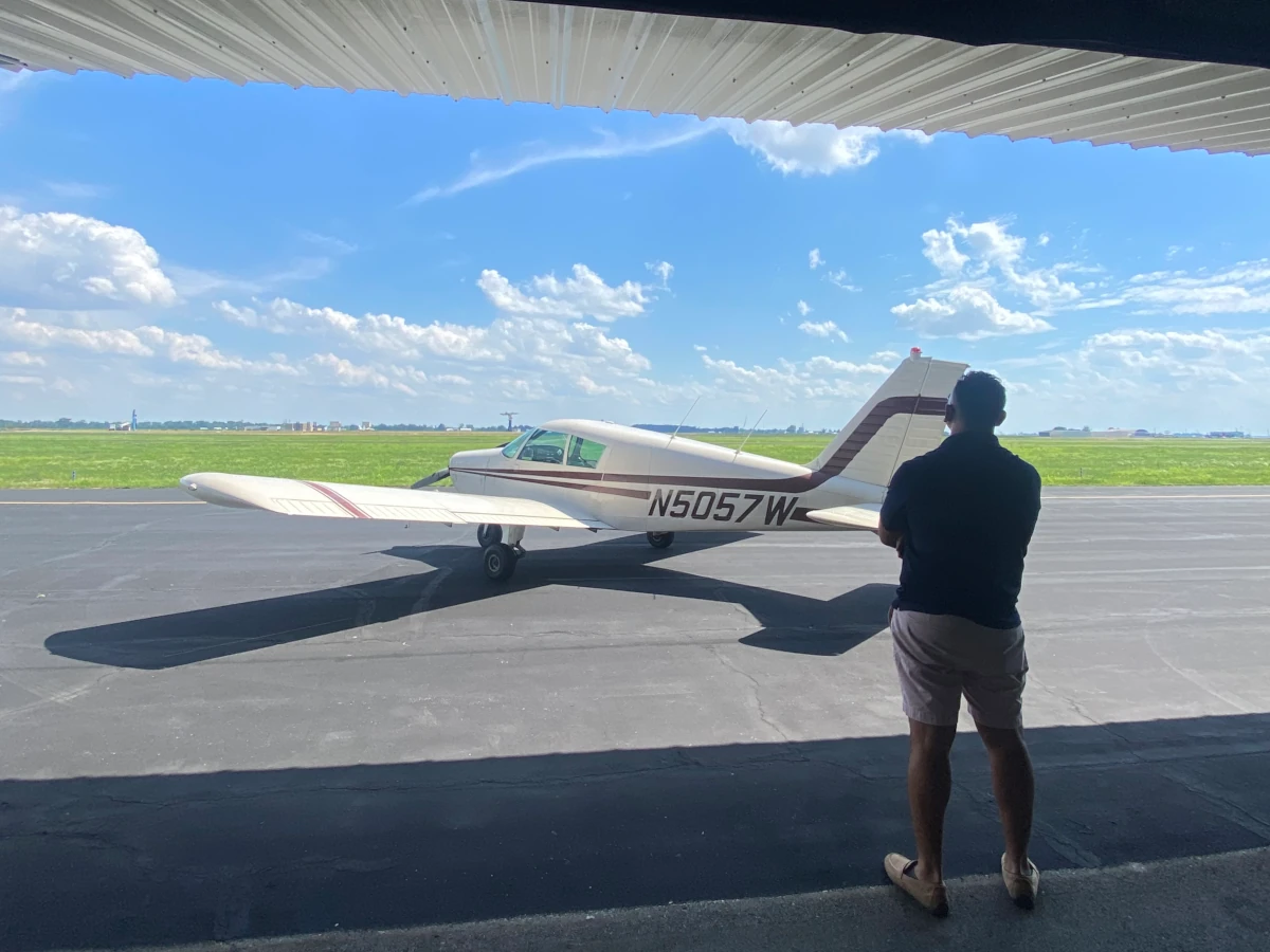 Tim looking at a Piper Cherokee